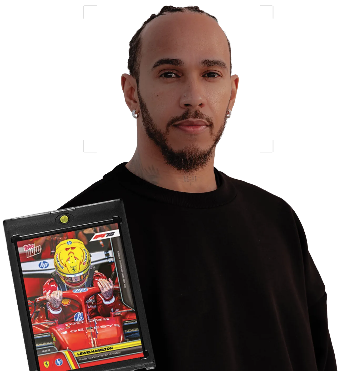 Lewis Hamilton holding a Topps Now card from his Scuderia Ferrari debut